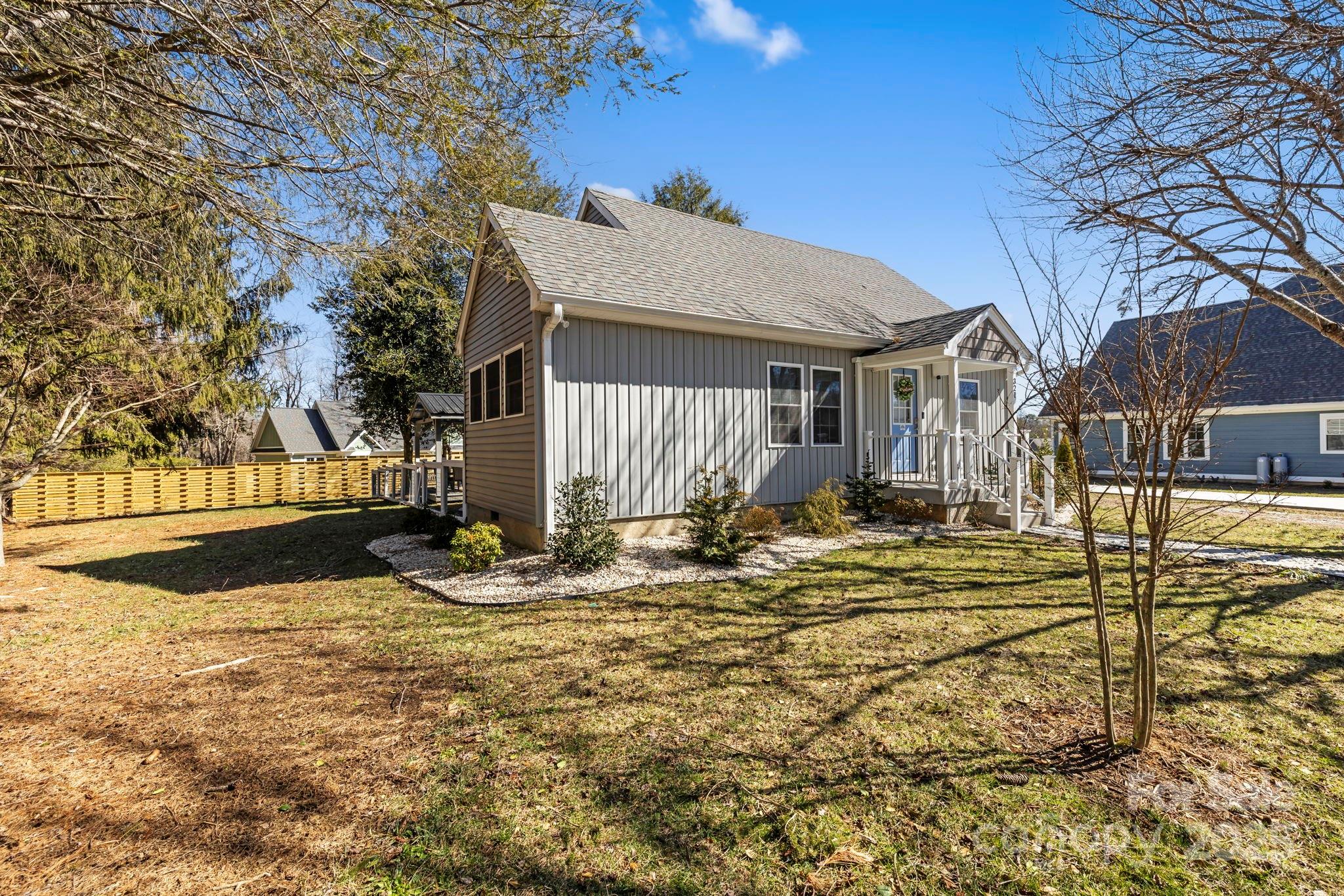 321 Ballenger Road Flat Rock, NC 28731 - Photo 2 of 32 a view of a house with snow on the background