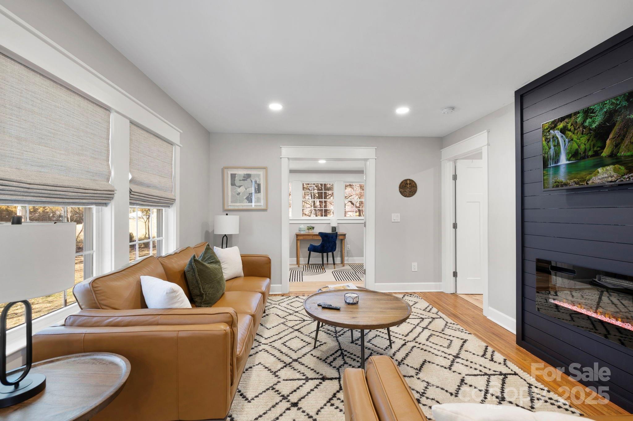 321 Ballenger Road Flat Rock, NC 28731 - Photo 10 of 32 a living room with furniture and a wooden floor