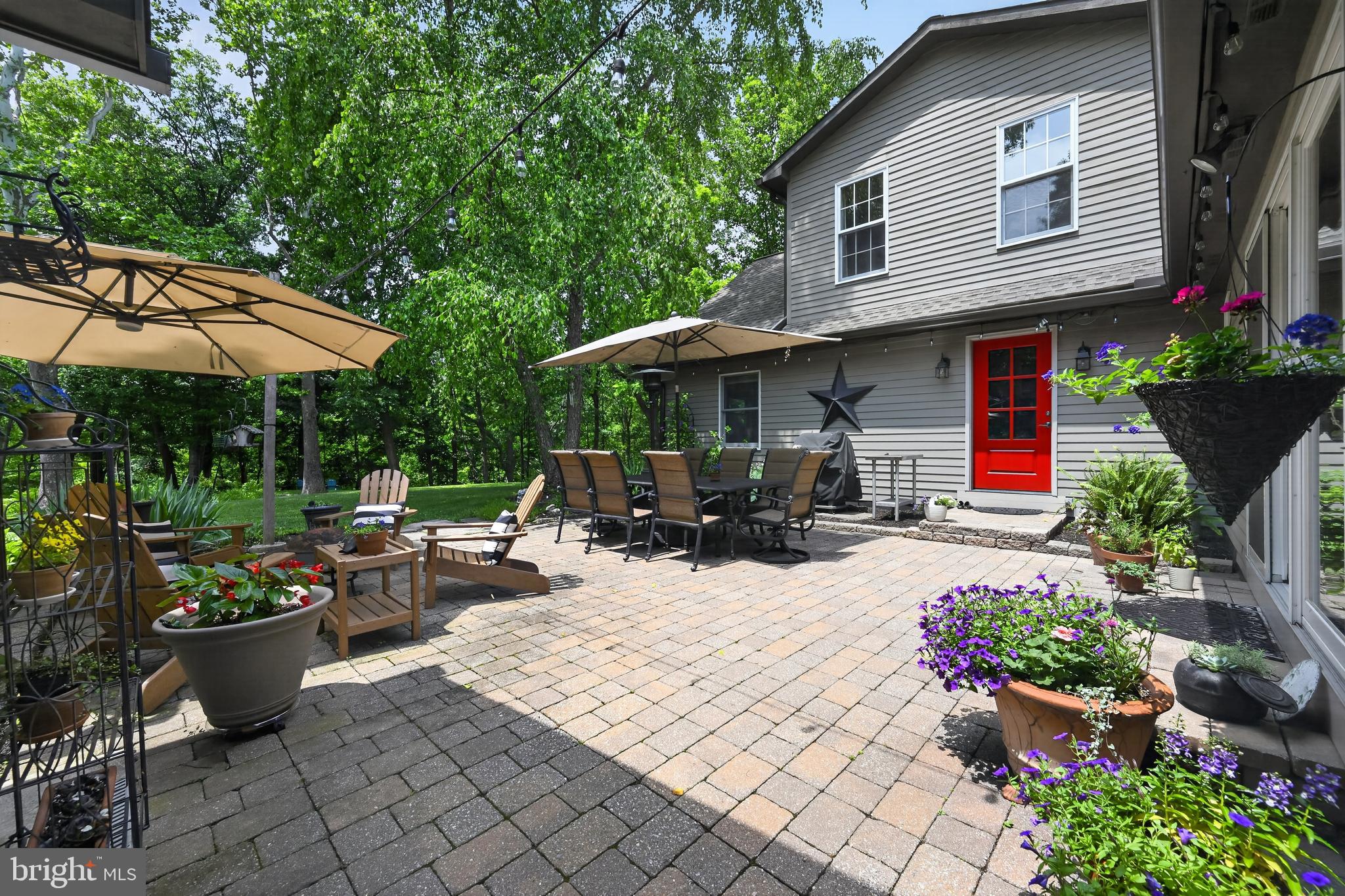 460 Wells Road Doylestown, PA 18901 - Photo 40 of 65 Charming patio oasis with vibrant blooms.