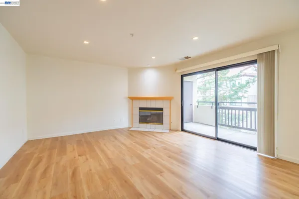 a kitchen with white cabinets and appliances