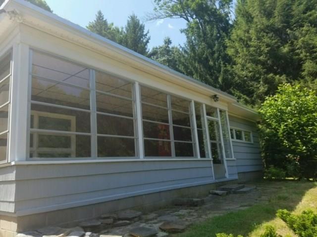 361 Storrs Road Mansfield, CT 06250 - Photo 1 of 1 a house with trees in the background