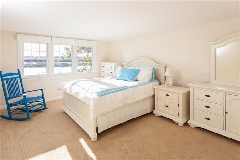 2 Great River Road Mashpee, MA 02649 - Photo 4 of 16 a bed room with a bed and a chair