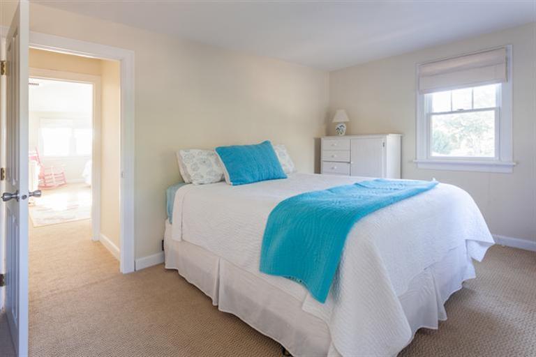 2 Great River Road Mashpee, MA 02649 - Photo 6 of 16 a bed sitting in a bedroom next to a window