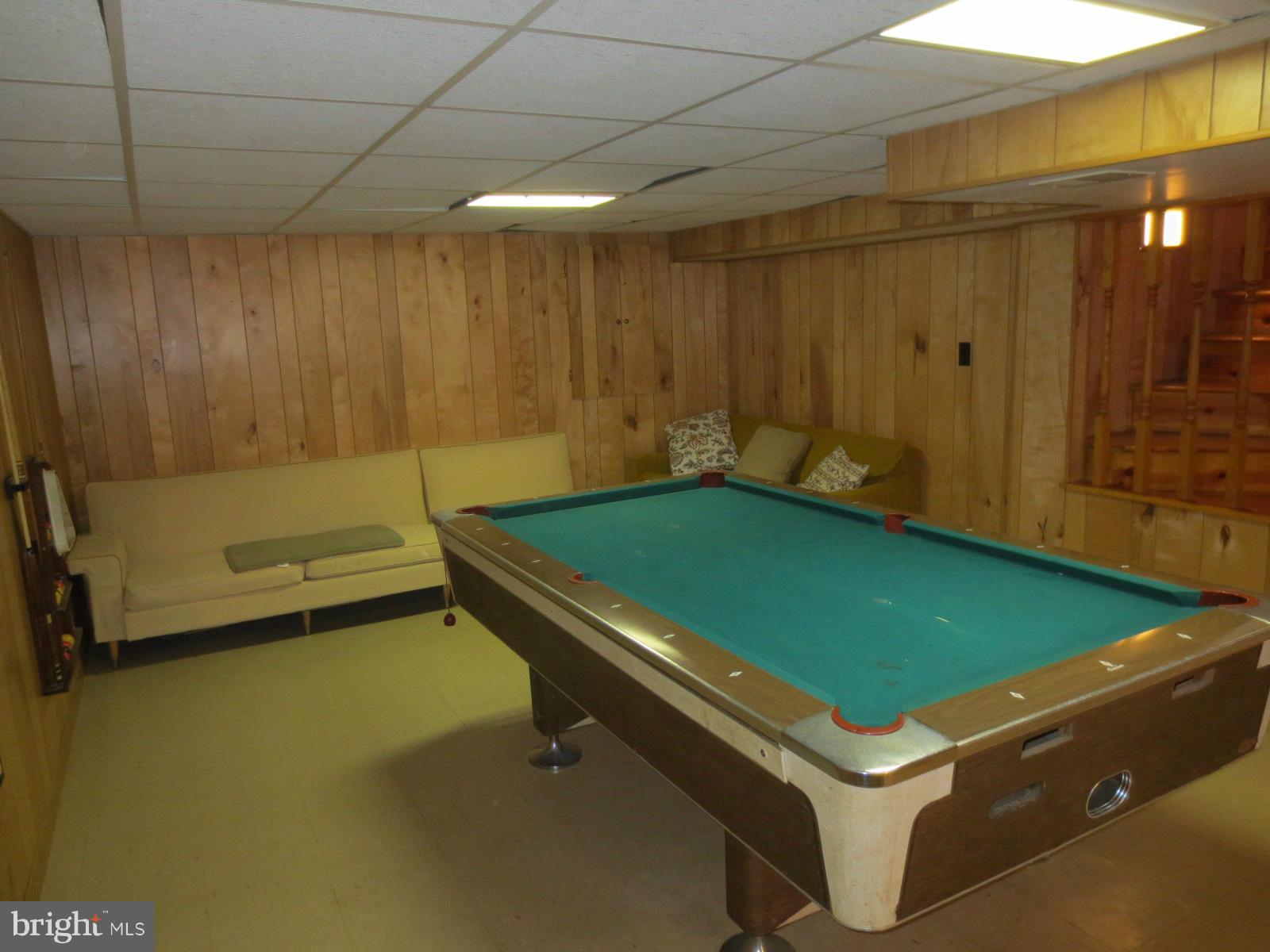2203 Chapman Road Hyattsville, MD 20783 - Photo 17 of 30 Rec room Pool table and couches convey