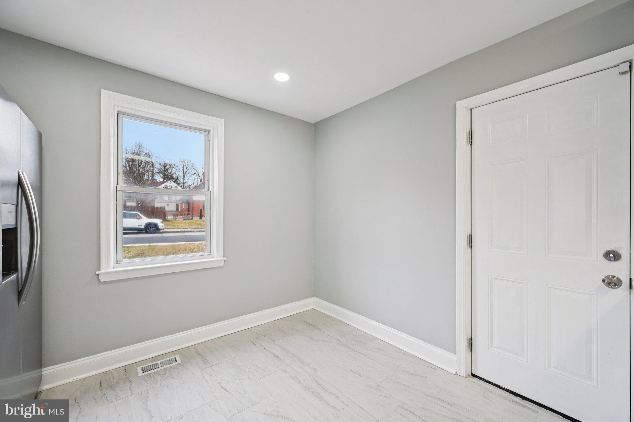 4902 Gilray Drive Baltimore, MD 21214 - Photo 14 of 54 an empty room with windows and closet