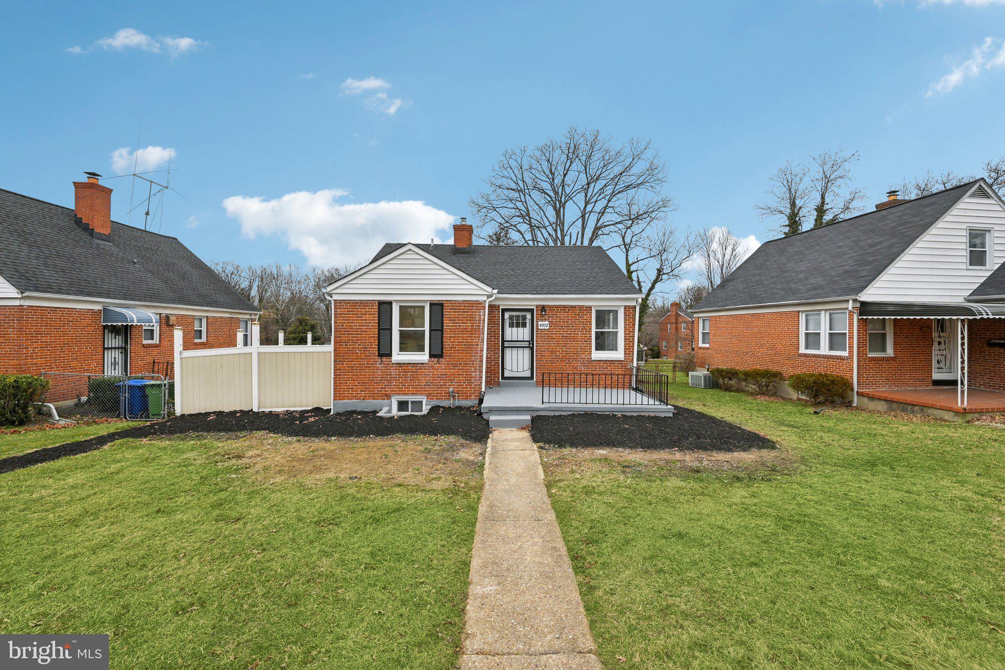 4902 Gilray Drive Baltimore, MD 21214 - Photo 2 of 54 a front view of a house with a yard