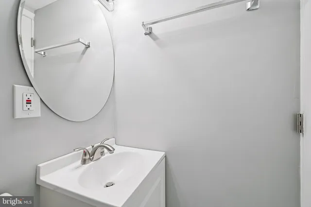 a bathroom with a shower a toilet and a sink