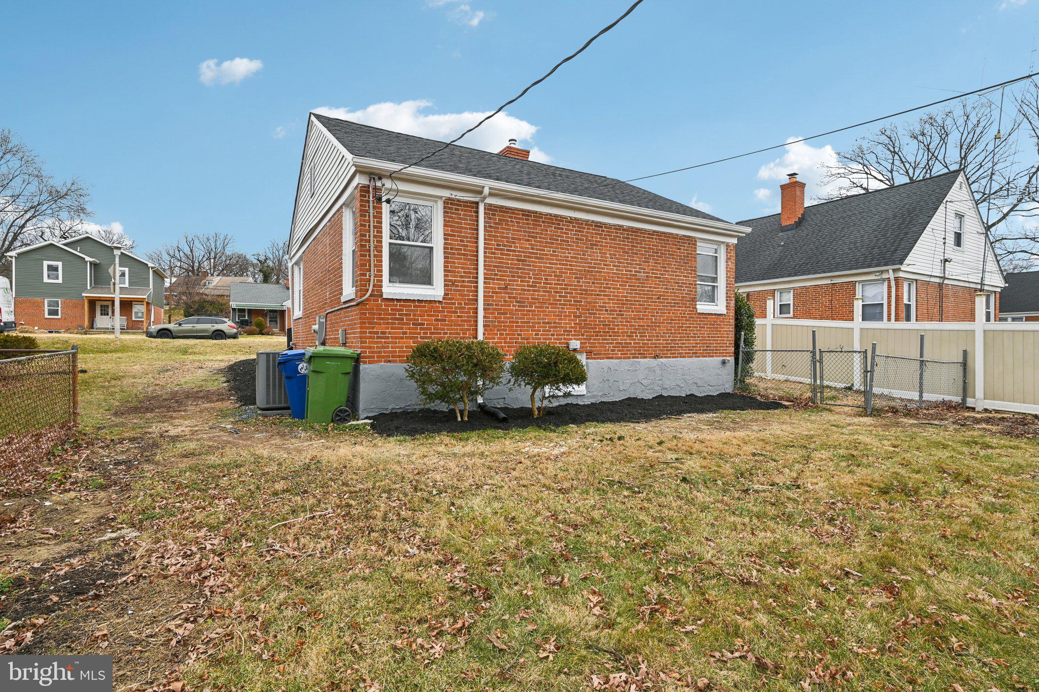 4902 Gilray Drive Baltimore, MD 21214 - Photo 48 of 54 a front view of a house with a yard