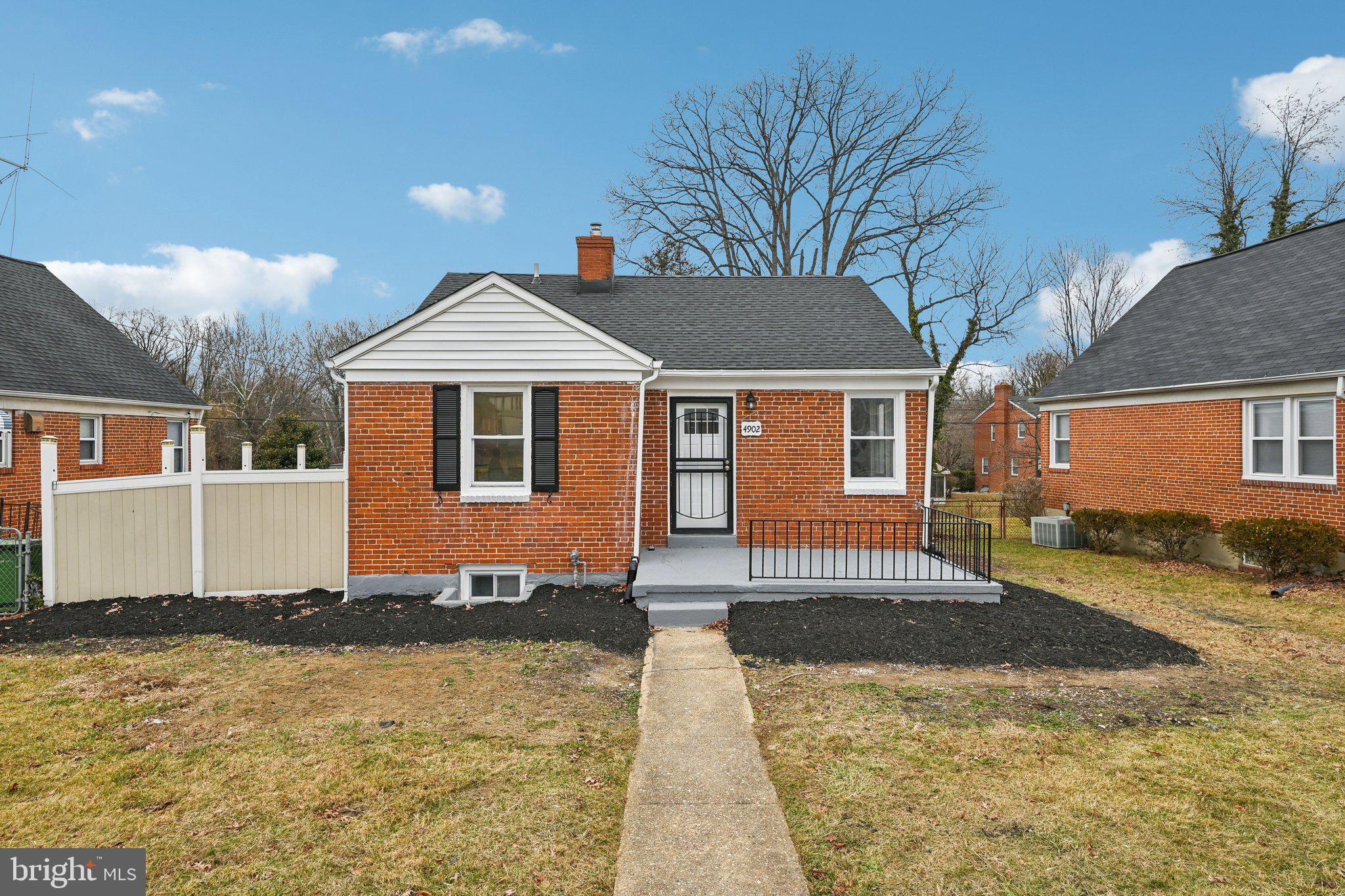 4902 Gilray Drive Baltimore, MD 21214 - Photo 5 of 54 a front view of a house with a yard