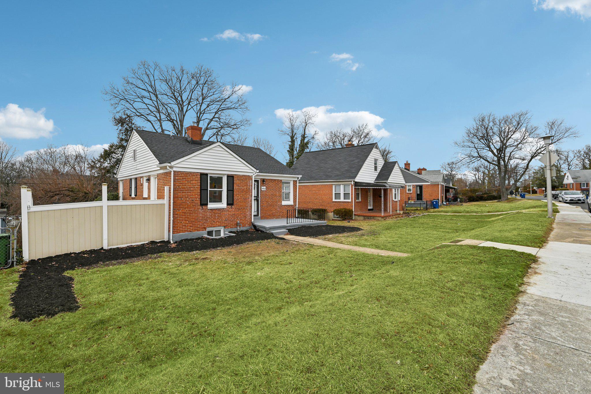 4902 Gilray Drive Baltimore, MD 21214 - Photo 7 of 54 a front view of a house with a yard