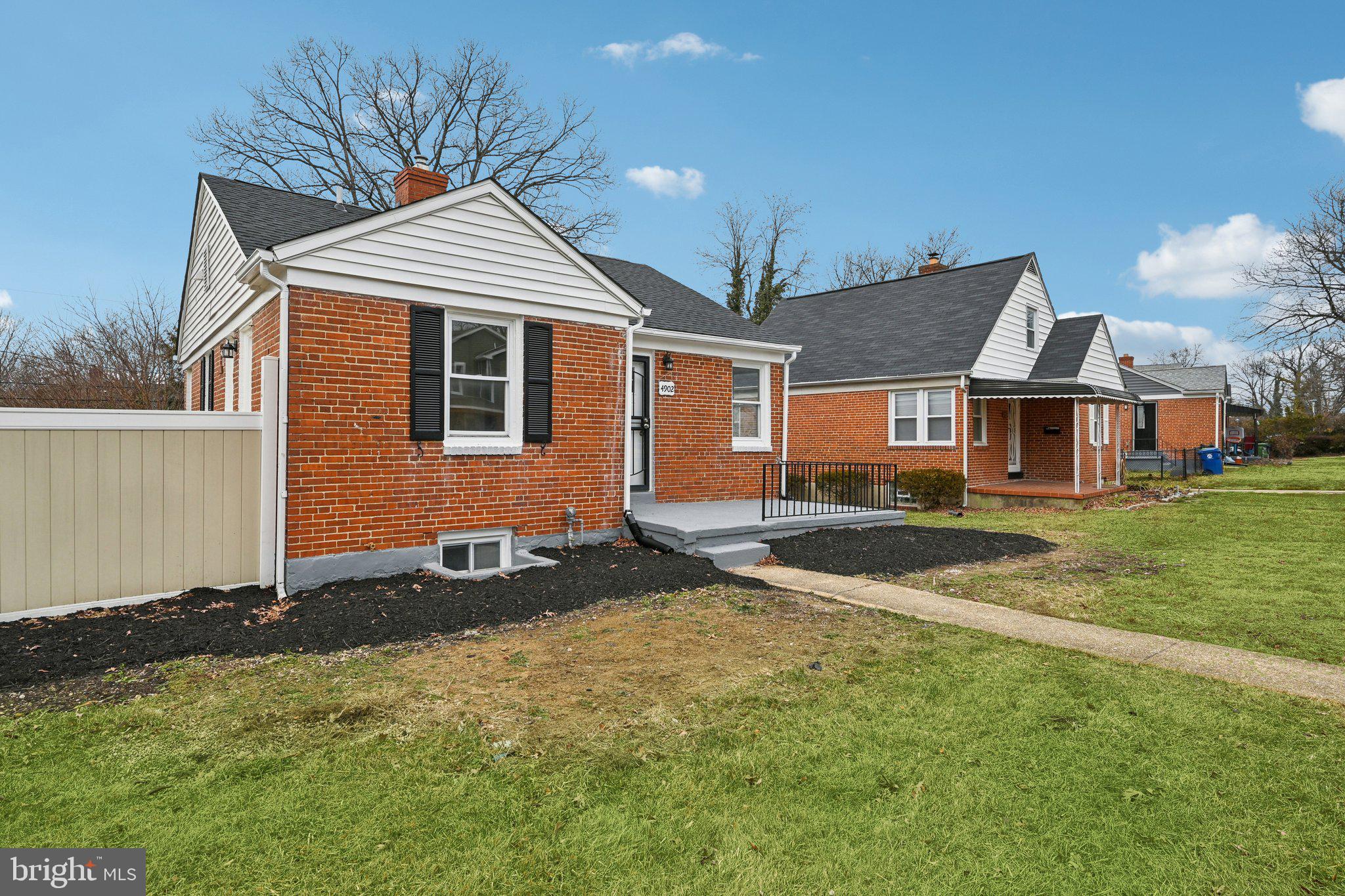 4902 Gilray Drive Baltimore, MD 21214 - Photo 8 of 54 a front view of a house with a yard