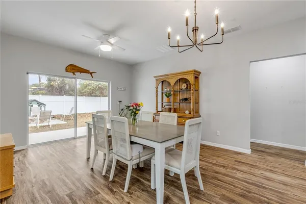 a bathroom with a sink and a wooden floor