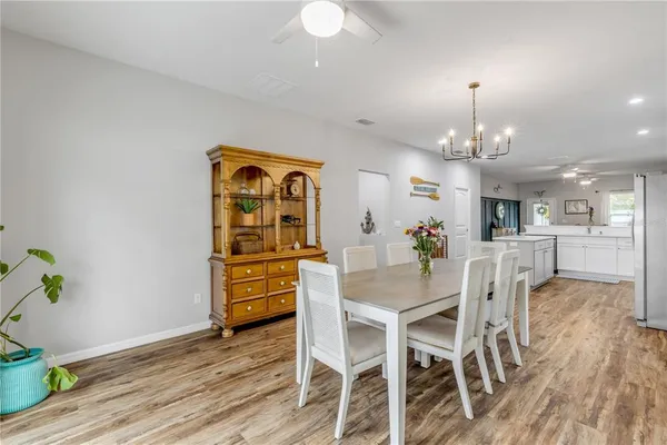 a room with toys and dresser with wooden floor