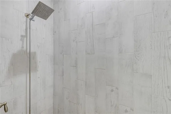 a bedroom with a bed and a dresser in it