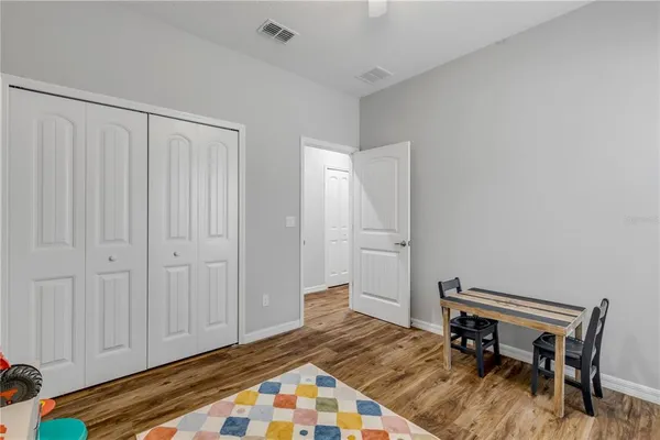 a view of yard with swimming pool and seating