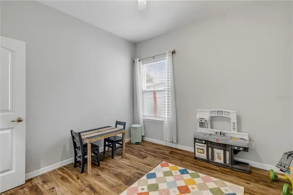 a view of a backyard with table and chairs and a fire pit