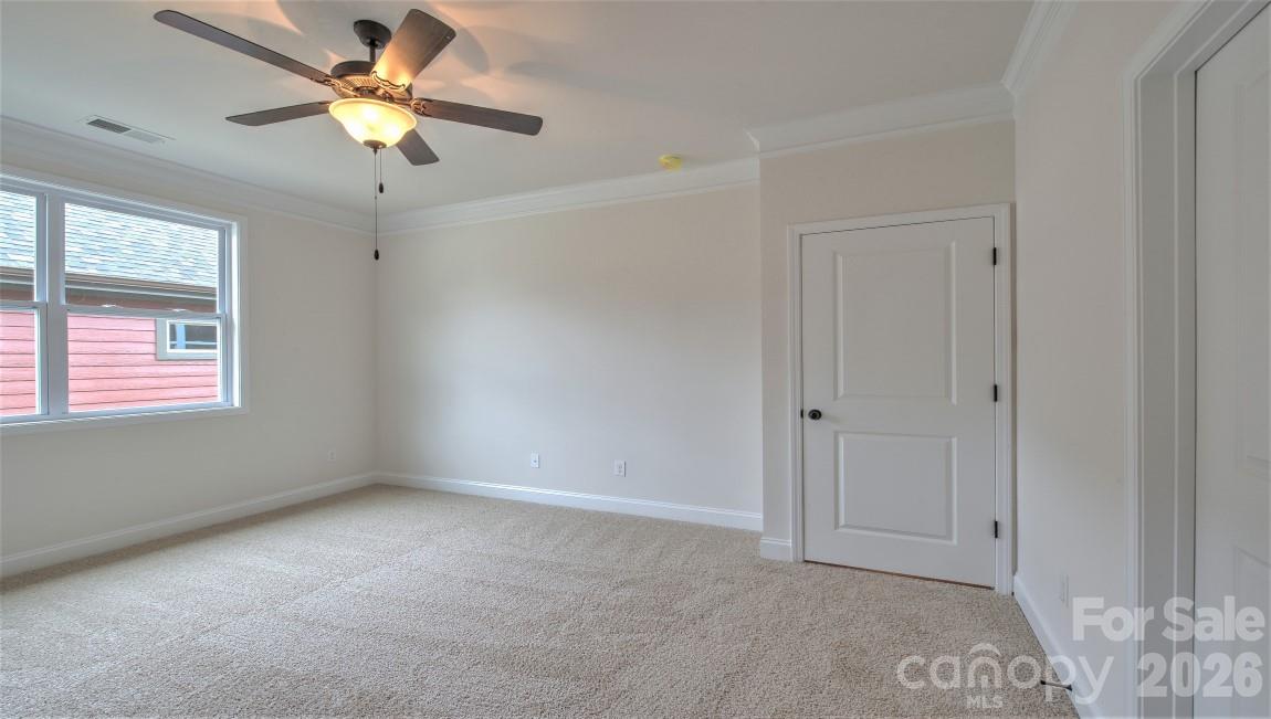 649 River Btm Road Fletcher, NC 28732 - Photo 31 of 40 an empty room with windows and fan