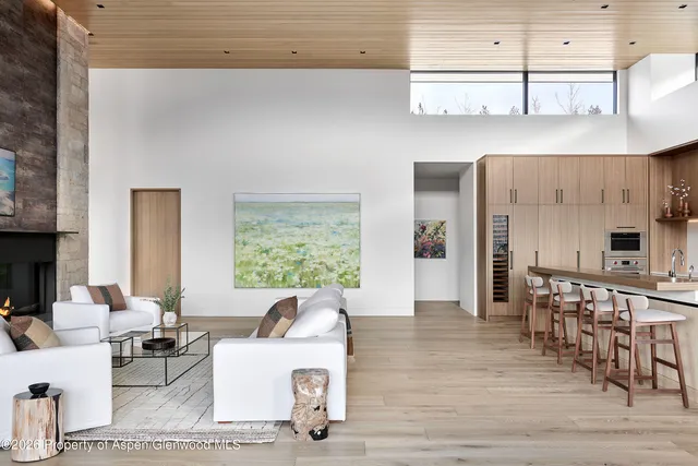 a dining table with chairs and window