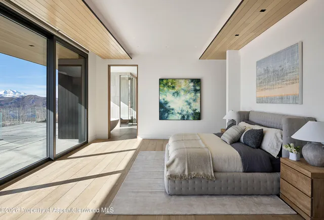 a bathroom with a bathtub and a window