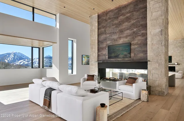 a bedroom with a large bed and a large window