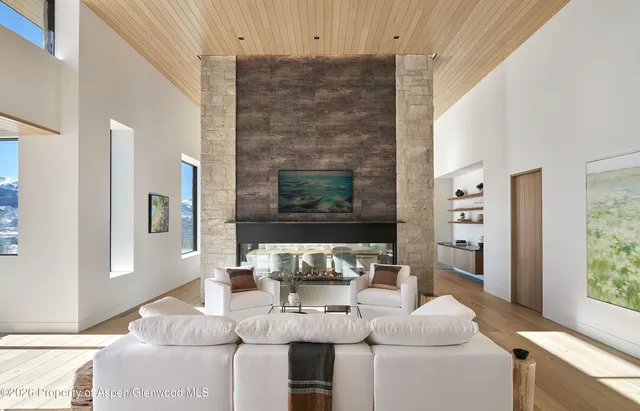 a view of a bathtub in front of window with a view of balcony