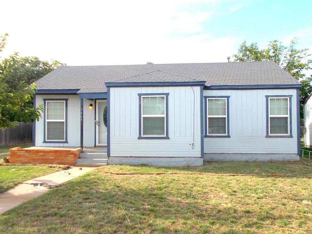 1409 East 11th Place Big Spring, TX 79720 - Photo 2 of 12 a front view of a house