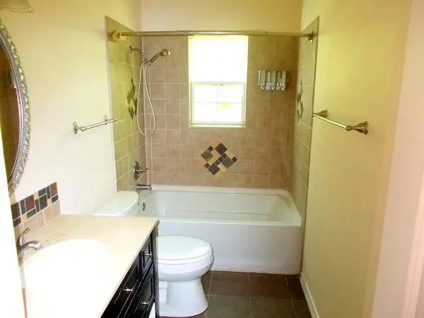 a bathroom with a sink a toilet and a bathtub