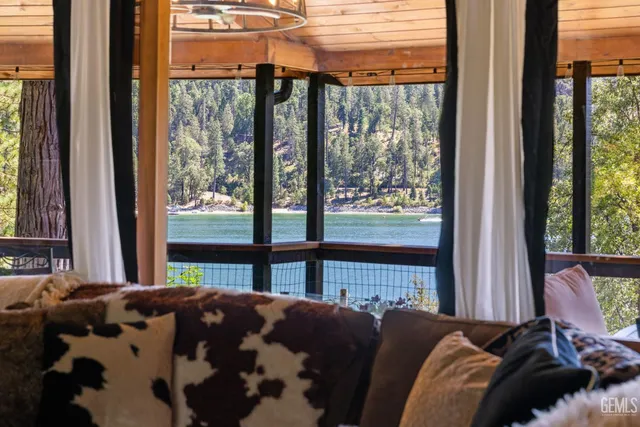 a kitchen with granite countertop a stove a sink dishwasher and cabinets