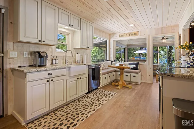 a view of a patio with a table chairs and a backyard