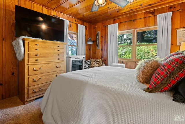 a living room with furniture fireplace and flat screen tv