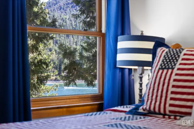 a view of a patio with table and chairs and potted plants