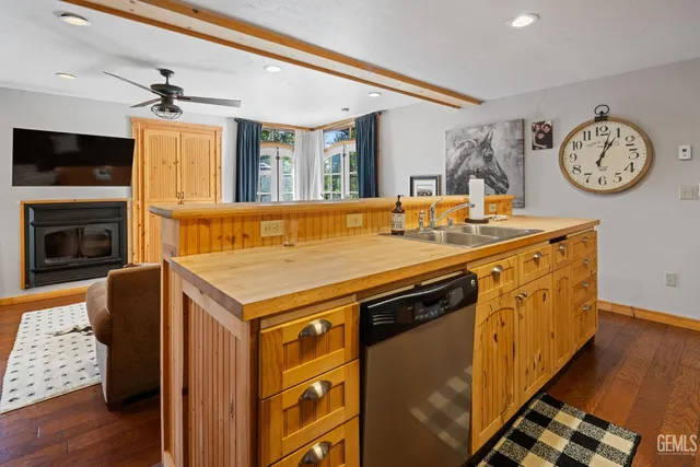 a bedroom with a flat screen tv and a window