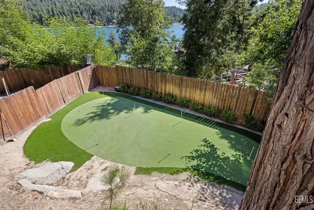a bedroom with a bed next to a window