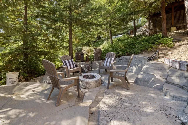 an aerial view of a house with yard swimming pool and outdoor seating