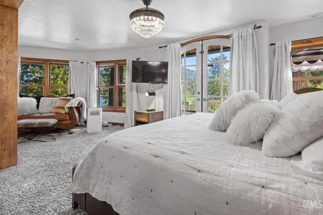 a picture of a bathroom with a white wall