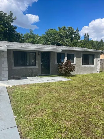 a house view with a garden space