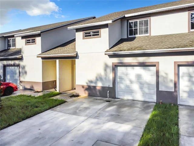 a kitchen with a sink stove and refrigerator