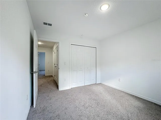 an empty room with a empty space and window