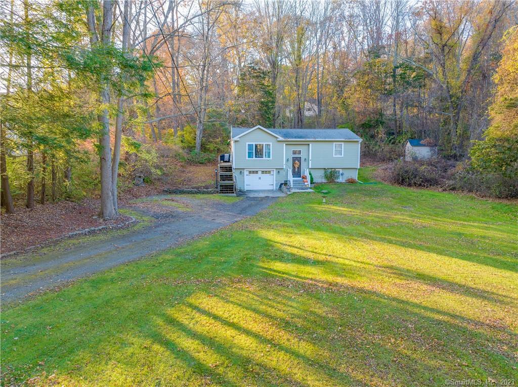 7 Bushnell Road Lisbon, CT 06351 - Photo 1 of 1 a front view of a house with garden