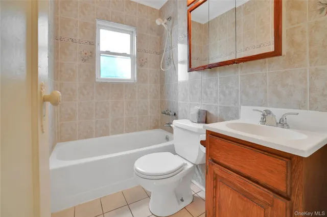 a bathroom with a sink a toilet and bathtub