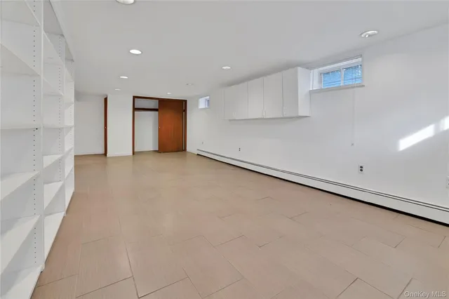 an empty room with a empty space and windows