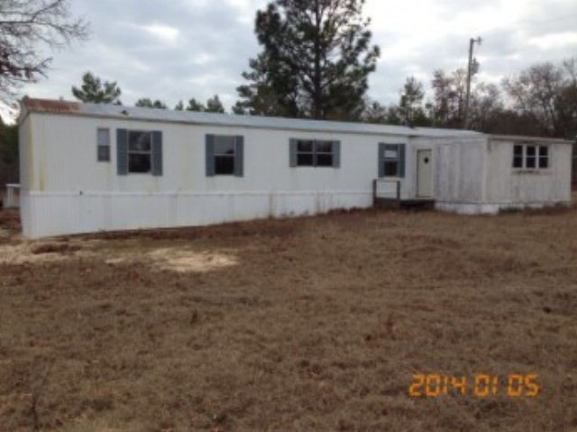 590 Carl Sutton Road Lizella, GA 31052 - Photo 3 of 3 a view of a backyard of the house