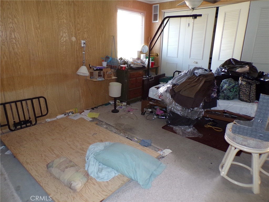 4880 Bonanza Road Johnson Valley, CA 92285 - Photo 13 of 19 a room with gym equipment and a mirror