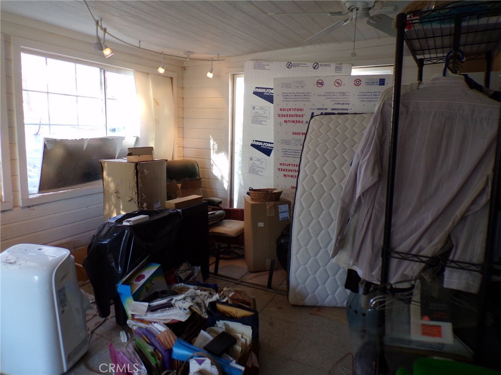 4880 Bonanza Road Johnson Valley, CA 92285 - Photo 15 of 19 a view of workspace with wooden floor windows