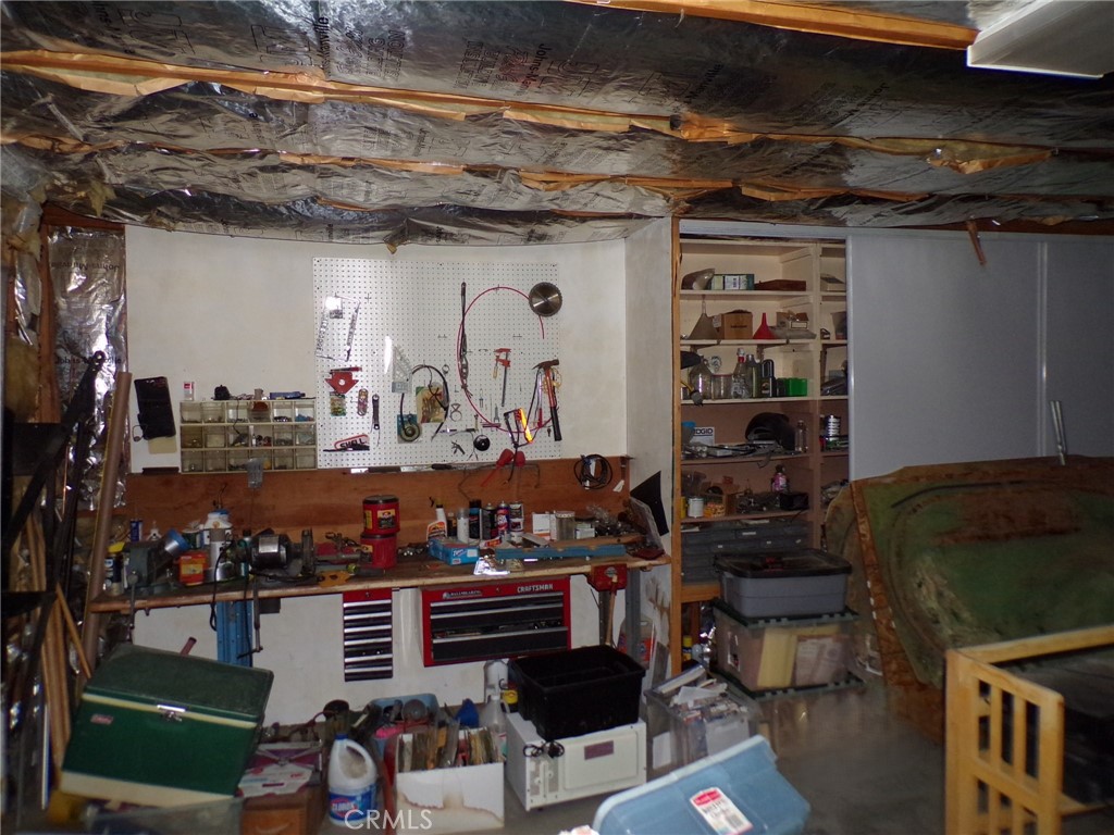 4880 Bonanza Road Johnson Valley, CA 92285 - Photo 16 of 19 a room with lots of different colored cloths