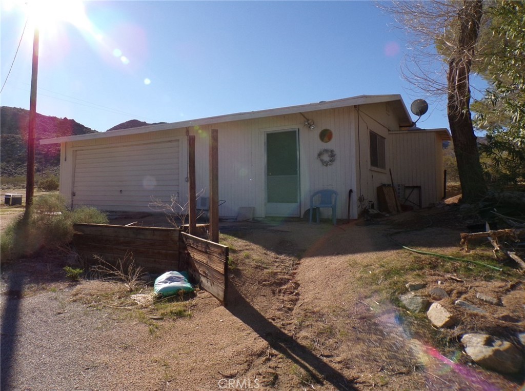4880 Bonanza Road Johnson Valley, CA 92285 - Photo 4 of 19 a front view of a house with a yard