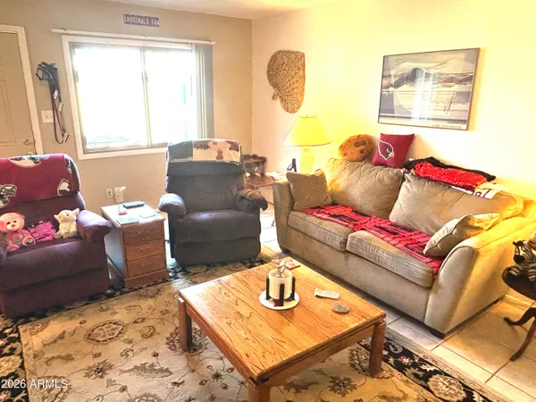 a living room with furniture and a table