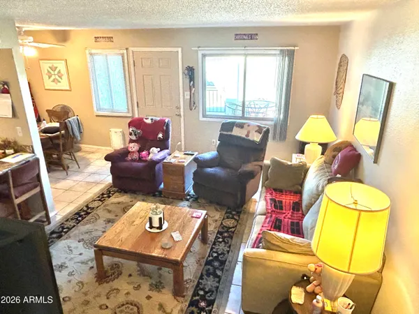 a view of a dining area with furniture and a mirror