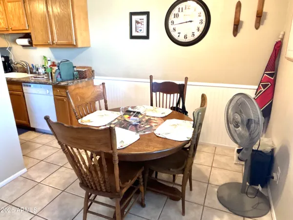 a view of a dining area with furniture and a window
