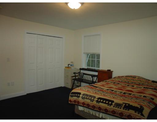 385 Williamsville Road Phillipston, MA 01331 - Photo 11 of 18 a bedroom with a bed and a table